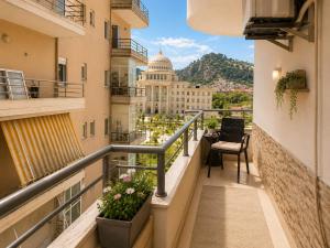 a balcony with a view of the capitol building at Berat Skyline Apartment in Berat