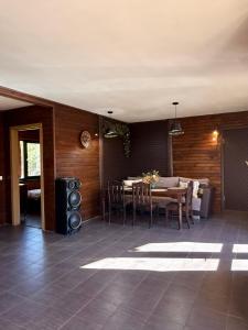 a dining room with a table and chairs at Meiranu krasts in Bērzgale