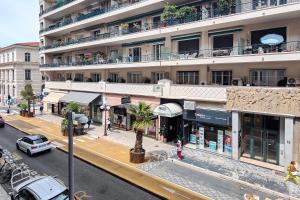 an overhead view of a city street with a building at Hôtel Helvétique in Nice