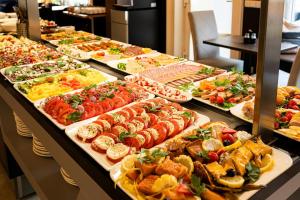 a buffet line with many different types of food at Baltic Home in Świnoujście