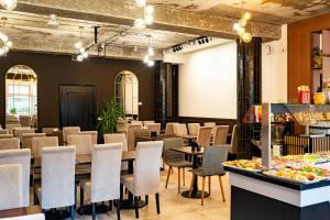 a restaurant with tables and chairs in a room at Baltic Home in Świnoujście +46 photos
