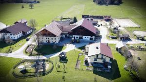 an aerial view of a large house with a yard at Kinderparadies Bachbauer in Mondsee