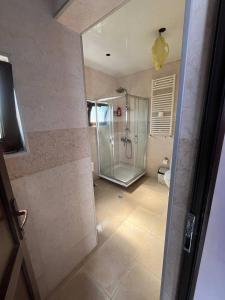 a bathroom with a shower and a toilet in it at Chavchavadze 56 in Kobuleti +39 photos