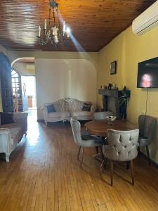 a living room with a table and a couch at Chavchavadze 56 in Kobuleti