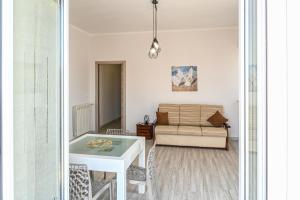 a living room with a couch and a table at Il rifugio di eva in Alberobello +32 photos