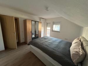 a bedroom with a large bed in a room at Sarajevo Villa Oasis in Doglodi