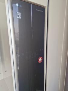 a glass door with a sticker on the side of a building at Sj라벨라 강서 in Samgong