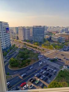 an aerial view of a parking lot in a city at Sj라벨라 강서 in Samgong +2 photos