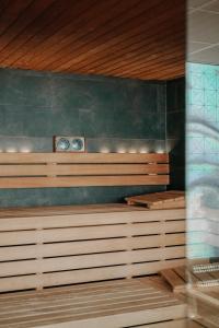 a sauna with two clocks on the wall at WestCord Hotel Eindhoven in Eindhoven