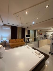 a living room with a couch and a table at Venis House in Plovdiv