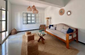 a living room with a couch and a table at Ca sa Madona Hostal in Paguera