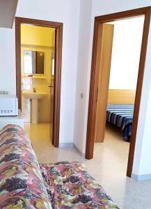 a view of a living room with a couch and a sink at VILLA ROSSINI in Valledoria +33 photos