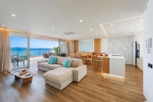 a living room with a couch and a table at Apartment Vistamar IV in Port de Pollensa