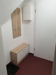 a room with a drawer and a cabinet and a door at Sauberghaus Wohnung 3 in Breitenbrunn +11 photos