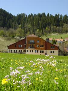 a field of flowers in front of a building at Espace Morteau in Morteau