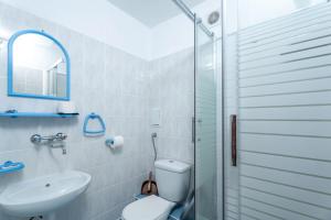 a bathroom with a toilet and a sink and a shower at Ośrodek Wypoczynkowy AS PIK dawniej Hotel AS PIK in Niechorze +104 photos