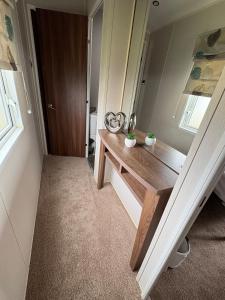 a room with a dressing table and a mirror at Skyline in Lossiemouth +2 photos