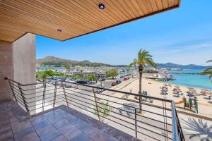 a balcony with a view of a beach and the ocean at Apartment Vistamar III in Port de Pollensa