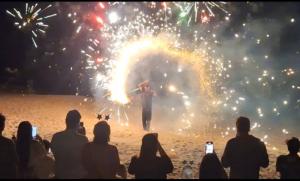 a man singing on a stage with fireworks at White Sand Samui Resort in Lamai +97 photos