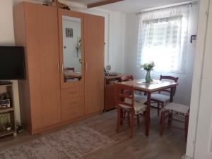 a room with a table and a dining room at Smještaj Dada in Trebinje