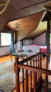 a living room with a bed and a table at Azure Escape Villa in Platamonas