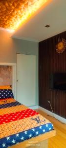 a bedroom with a bed with an american flag bedspread at Gerry's Place in Iloilo City