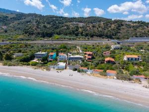 an aerial view of a beach with houses and the ocean at Villa Dorianna in Egira