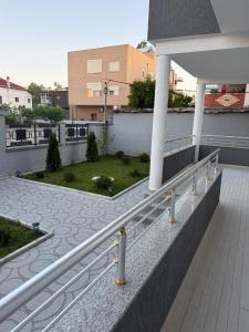 a balcony of a building with a stair railing at Alison Guest House in Durrës