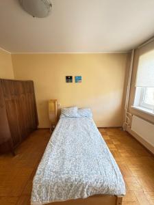 a bedroom with a bed in the corner of a room at Joy Haven in Tallinn