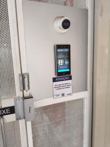 a machine with an atmegaoco sign on a door at Flats Rio Branco in Uberaba
