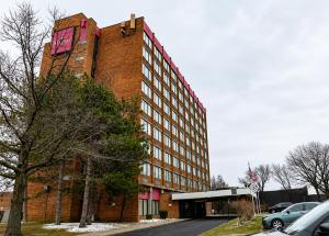 a large red brick building with a clock on it at Central Albany Room with Breakfast & view in Albany