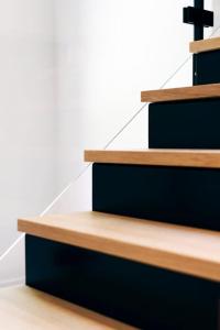 a set of wooden stairs with a cross on them at Villa de Luxe à Malmedy pour 14 personnes en Ardenne in Malmedy