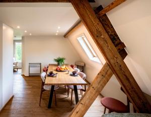 a dining room with a table and chairs at Ryckevelde in Damme