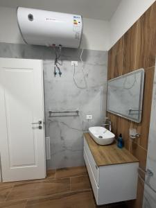 a bathroom with a white sink and a mirror at Alison Guest House in Durrës +37 photos