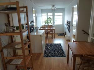 a living room with a kitchen and a dining room at Sven Fredriksson Bed & Breakfast in Norrtälje