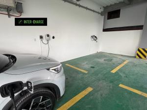 a parking lot with a car parked in a garage at LUNA by LCB Apartelle and Resort Tagaytay in Tagaytay