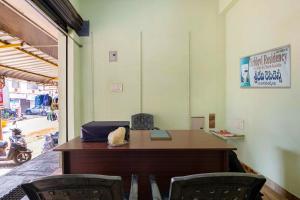 an office with a desk and two chairs at Hotel Sridevi Grand in Vākalapūdi