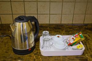 a coffee pot sitting on top of a kitchen counter at Dar NEYAARA SERVICED APARTMENTS - Economic in Riyadh