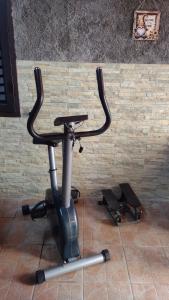 a exercise bike parked next to a brick wall at LA PETITE MAISON in Fucecchio