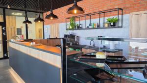 a restaurant kitchen with a counter and a counter top at Rest&Drive in Warszowice