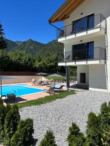 a villa with a swimming pool and a resort at Maso dell Apicoltore in Ledro +79 photos