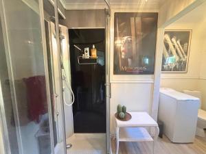 a small bathroom with a shower and a toilet at Villa Clara in Blankaholm +63 photos