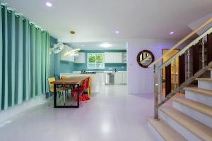 a kitchen and dining room with a table and chairs at Villa Paradise a unique cocoon in Bophut
