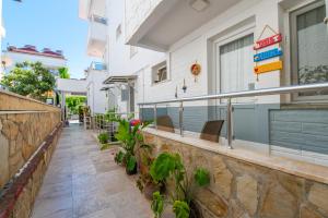 a balcony of a house with plants at Royalis Apart Hotel in Fethiye