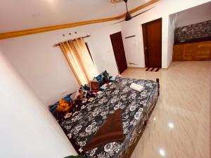 a bedroom with a bed in a room at Rooms Varkala Homestay in Varkala
