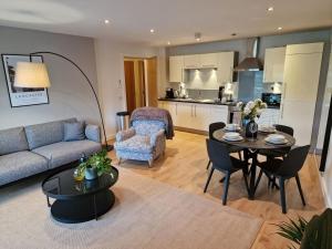 a living room with a couch and a table at Halton Hideaway in Halton