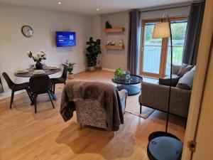 a living room with a couch and a table at Halton Hideaway in Halton