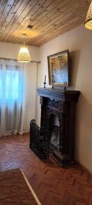 a fireplace in the corner of a living room at MAISON VATOSOA in Talata-maty