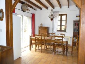a dining room with a table and chairs at "La Résistance" proche du Pal in Loddes