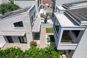 a view of the courtyard of a building with white buildings at Ilias Suites in Skala Potamias